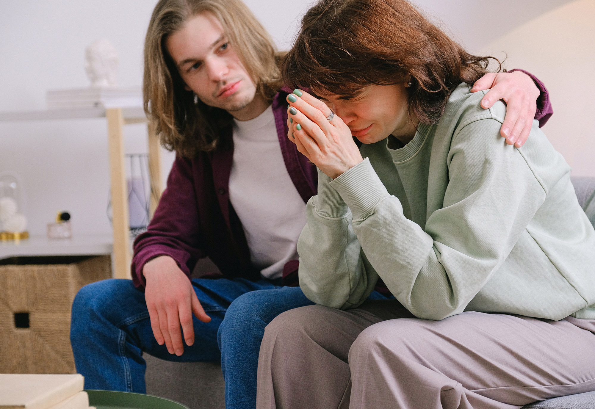 a young man consoling a woman who needs detox