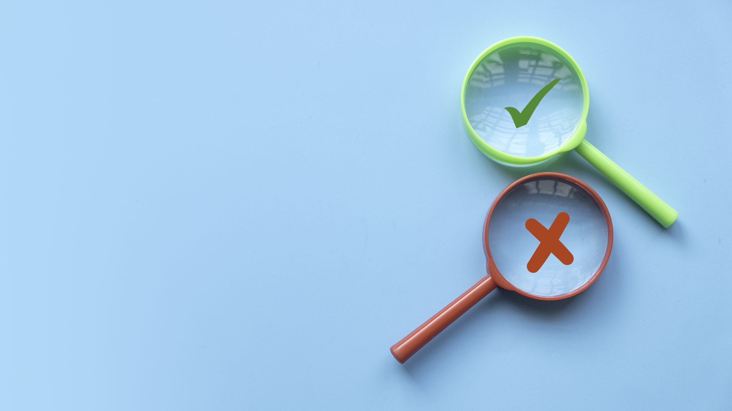 a red and green magnifying glass with an x and a check mark in them, highlighting the importance of an am I a codependent quiz