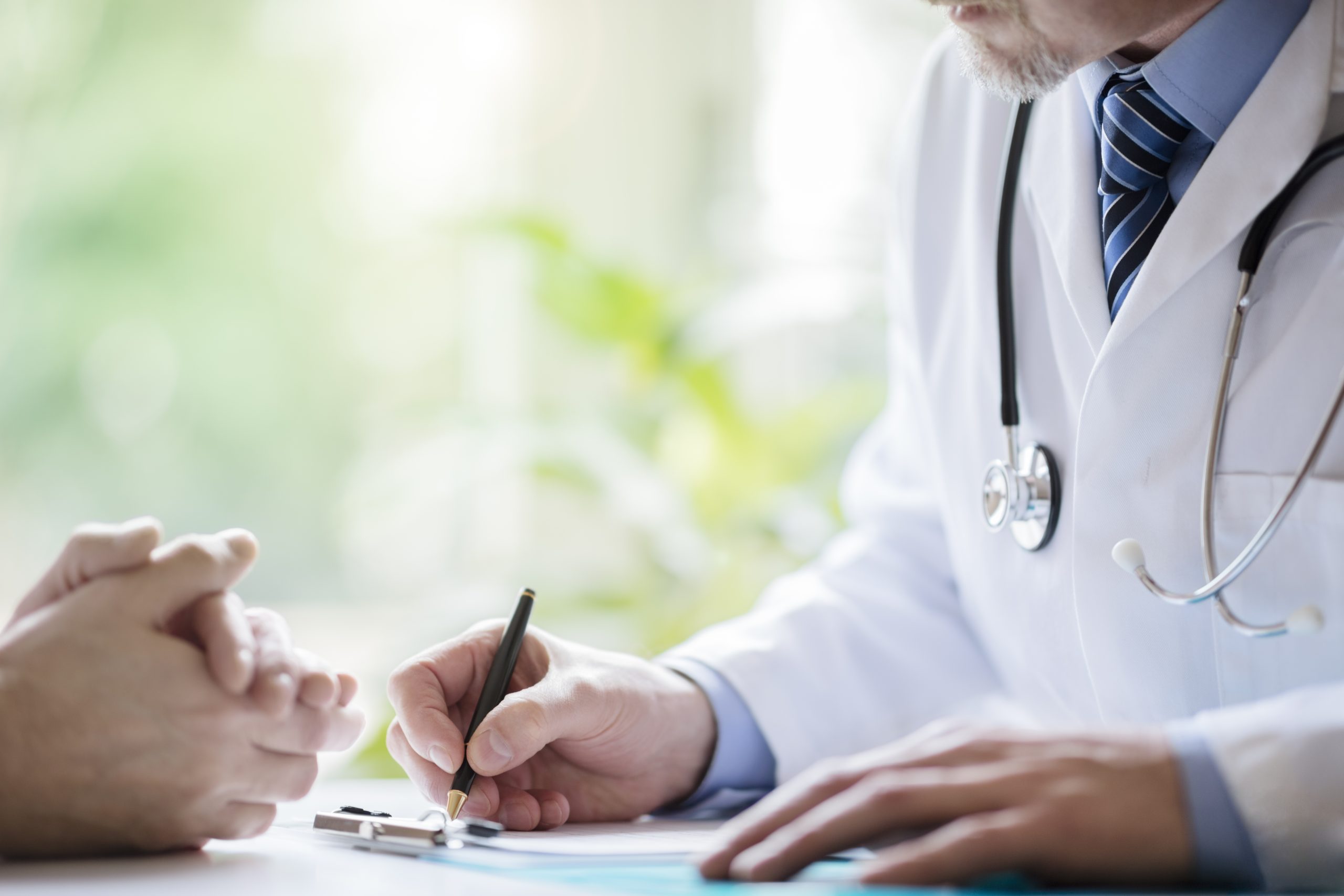 A doctor meeting with a patient to discuss medication assisted treatment for addiction