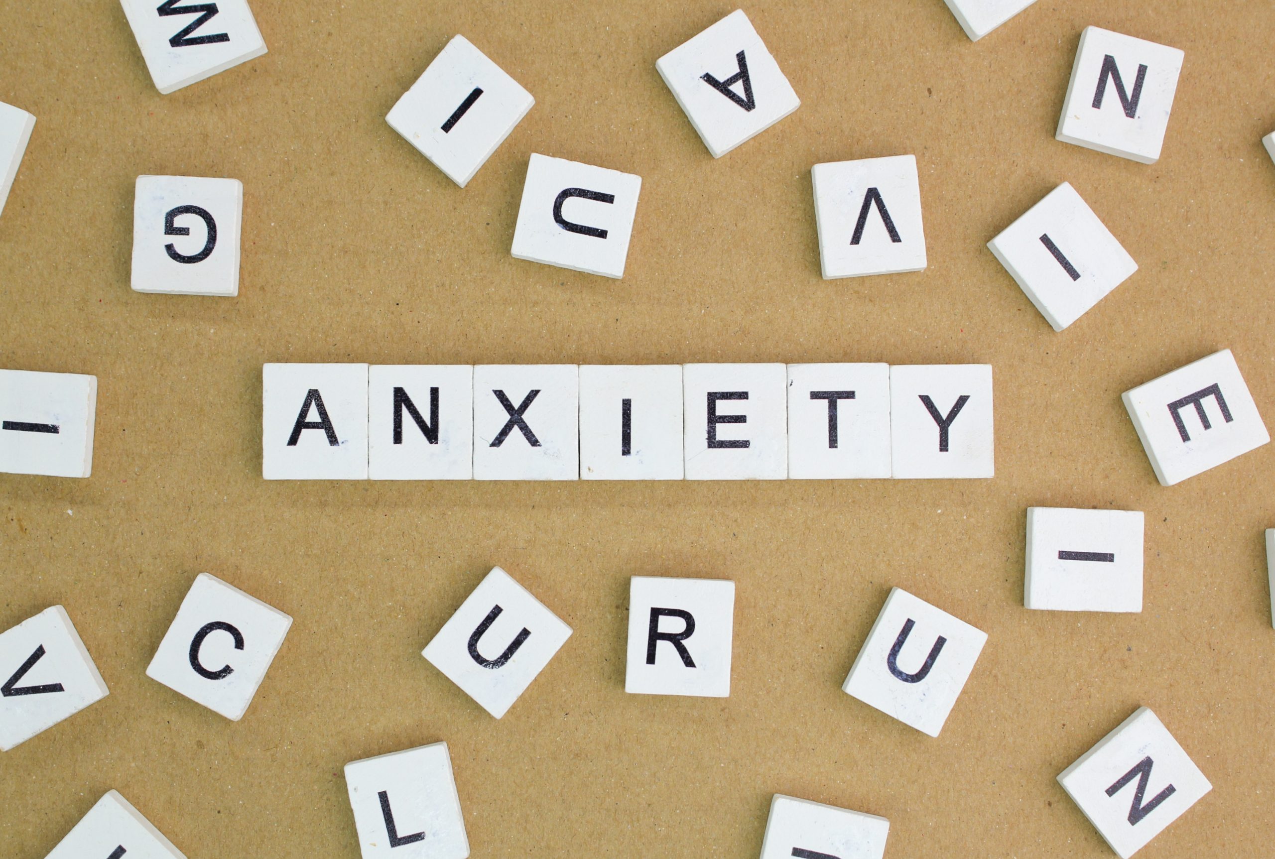 the word "anxiety" surrounded by multiple letters, highlighting the challenge of alcohol and anxiety