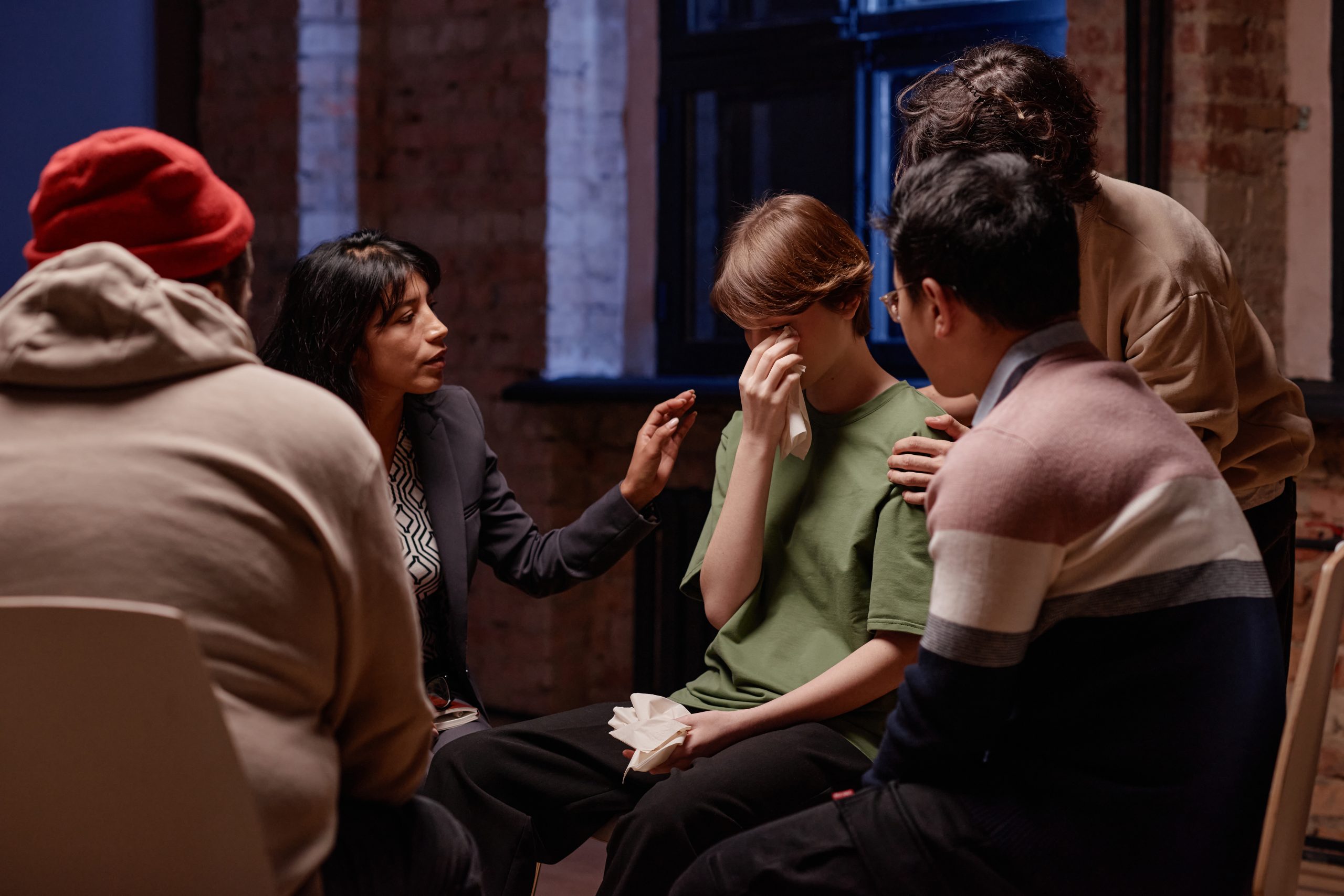 comforting a woman during an intervention for an alcoholic