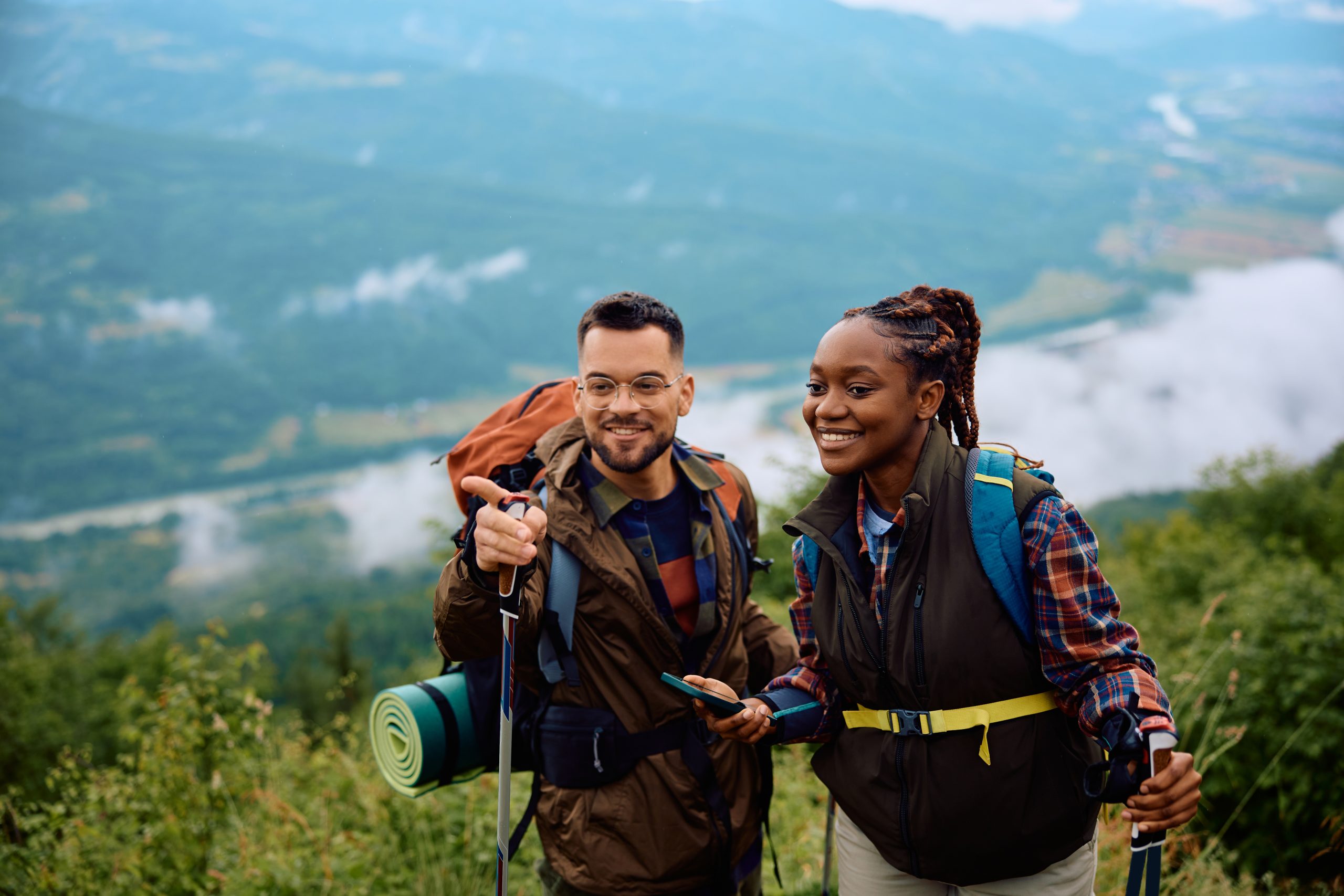 two people celebrating Anti-Boredom Month by hiking